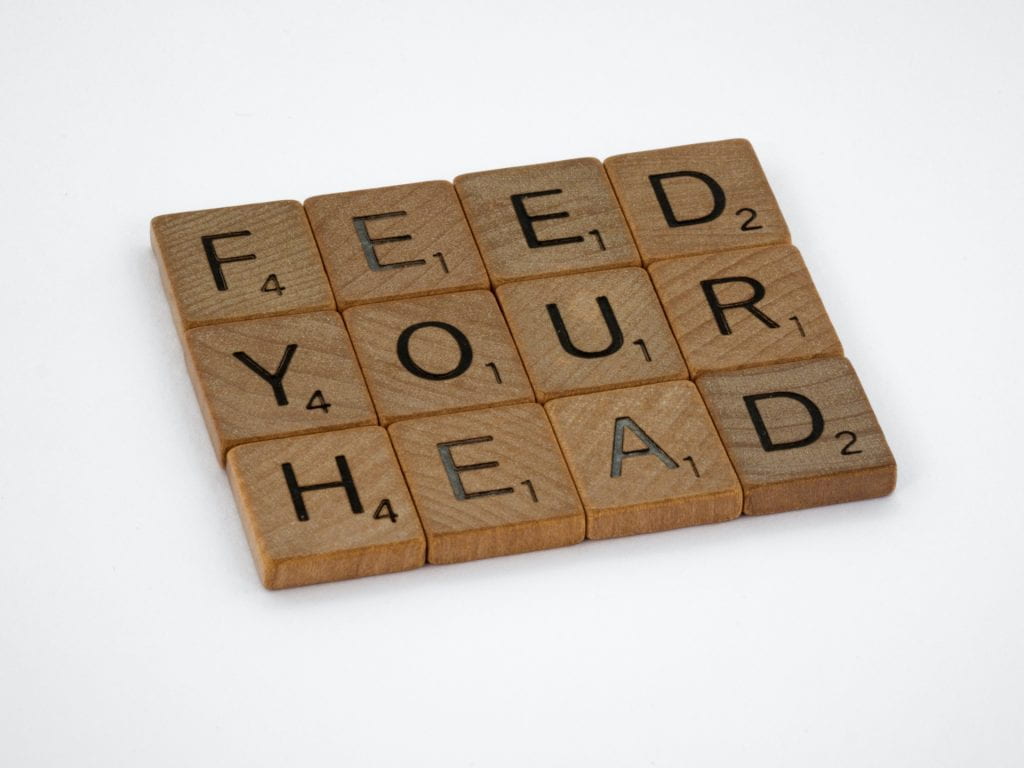 Scrabble tiles spelling "feel your head"